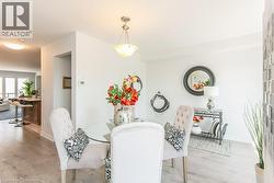 Dining space with light wood-style flooring - 