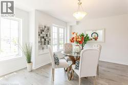 Dining space with wood finished floors and baseboards - 