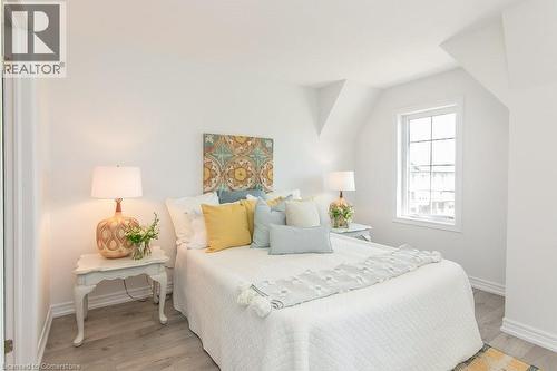 Primary Bedroom with dormer like windows, baseboards and light wood-style flooring - 386 Linden Drive, Cambridge, ON - Indoor Photo Showing Bedroom