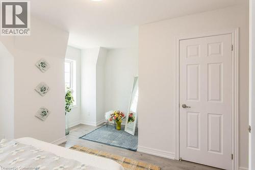 Primary Bedroom featuring wood finished floors - 386 Linden Drive, Cambridge, ON - Indoor Photo Showing Bedroom