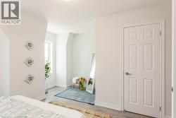 Primary Bedroom featuring wood finished floors - 