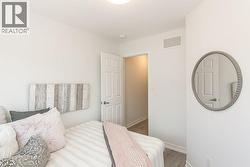 Bedroom with baseboards and wood finished floors - 