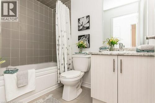 Main 4 pc Bathroom featuring tile patterned floors, vanity, and shower / bath combination with curtain - 386 Linden Drive, Cambridge, ON - Indoor Photo Showing Bathroom