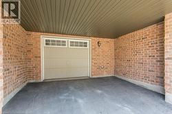Garage featuring driveway - 
