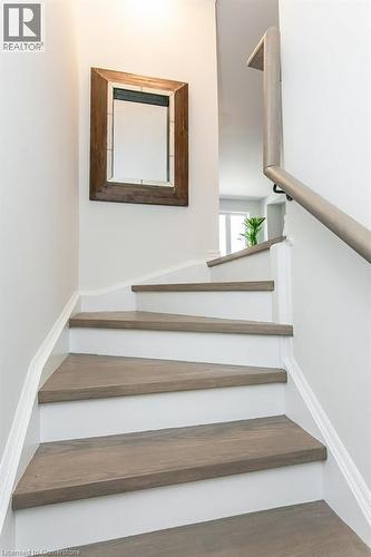 Staircase featuring wood finished floors - 386 Linden Drive, Cambridge, ON - Indoor Photo Showing Other Room