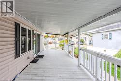 Wooden porch featuring a residential view - 