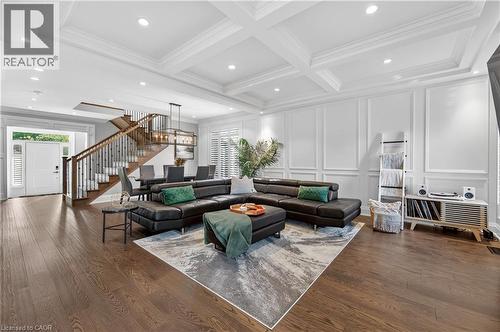 Living area featuring stairs, dark wood-style flooring, recessed lighting, coffered ceiling, and beam ceiling - 18 David Avenue, Hamilton, ON - Indoor