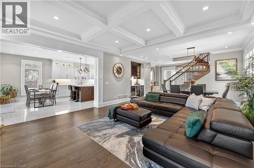 Living room featuring stairway, crown molding, beam ceiling, recessed lighting, and dark wood-style flooring - 18 David Avenue, Hamilton, ON - Indoor Photo Showing Living Room