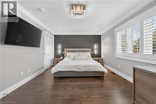 Bedroom with ornamental molding, dark wood-style flooring, and recessed lighting - 18 David Avenue, Hamilton, ON - Indoor Photo Showing Bedroom