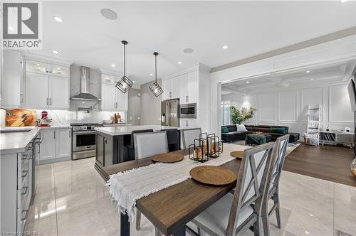 Dining space featuring a decorative wall, recessed lighting, coffered ceiling, and beam ceiling - 18 David Avenue, Hamilton, ON - Indoor Photo Showing Dining Room