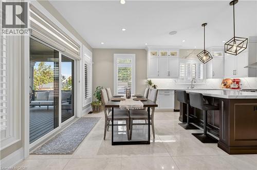 Dining area with light tile patterned floors and recessed lighting - 18 David Avenue, Hamilton, ON - Indoor