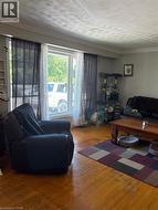 Living room with large triple windows over looking farmers feilds - 