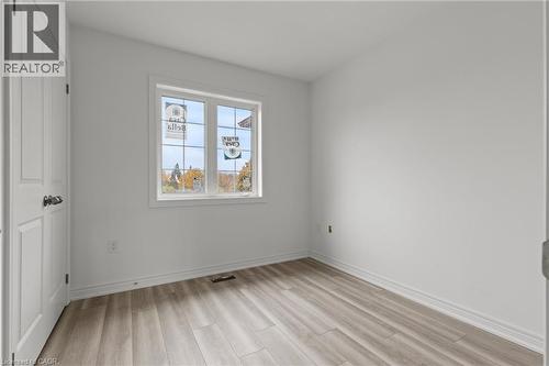 Spare room featuring light wood-type flooring and baseboards - 13 Davinci Boulevard, Hamilton, ON - Indoor Photo Showing Other Room