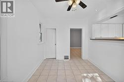 Spare room with light tile patterned floors, ceiling fan, and recessed lighting - 
