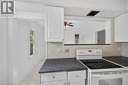 Virtually staged Bedroom featuring light wood finished floors, a closet, and vaulted ceiling - 
