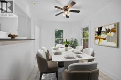 Virtually staged Dining space with ceiling fan, light tile patterned floors, and recessed lighting - 