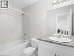 Full bath featuring  shower combination and vanity - 
