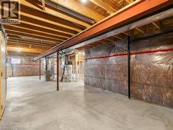 Unfinished basement featuring water heater and heating unit - 