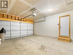 Garage with a garage door opener and baseboards - 