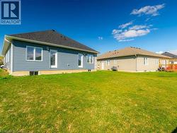 Rear view of property with a lawn - 