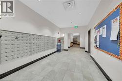 Hall with mail area and light tile patterned floors - 