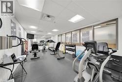 Workout area featuring a drop ceiling - 
