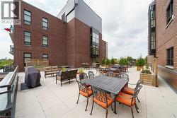 View of patio with an outdoor hangout area, area for grilling, and outdoor dining space - 