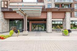 Doorway to property featuring stone siding - 
