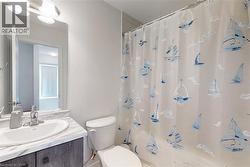 Bathroom with vanity and toilet - 