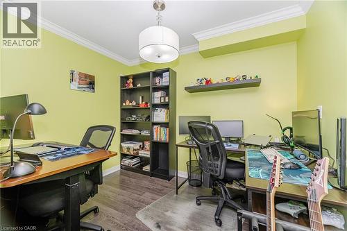 Office area featuring dark wood-style floors and ornamental molding - 5317 Upper Middle Road Unit# 112, Burlington, ON - Indoor Photo Showing Office