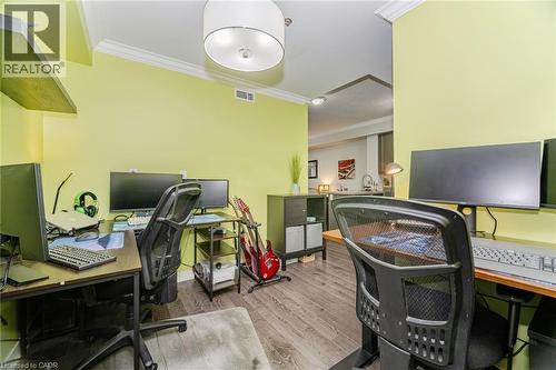 Office area featuring ornamental molding and wood finished floors - 5317 Upper Middle Road Unit# 112, Burlington, ON - Indoor Photo Showing Office