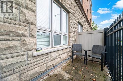 View of home's exterior with stone siding - 5317 Upper Middle Road Unit# 112, Burlington, ON - Outdoor