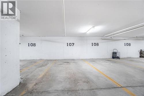 View of parking deck - 5317 Upper Middle Road Unit# 112, Burlington, ON - Indoor Photo Showing Garage