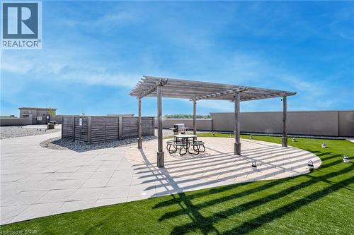 View of community with a patio area, a pergola, and a fenced backyard - 5317 Upper Middle Road Unit# 112, Burlington, ON - Outdoor