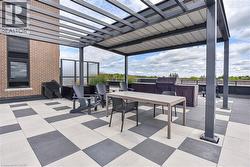 View of patio featuring outdoor dining space and a pergola - 