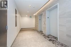 Hall featuring elevator and recessed lighting - 