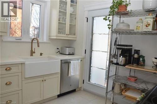 Bright kitchen with door to back porch and yard - 25 Fairmount Avenue, Hamilton, ON - Indoor Photo Showing Kitchen