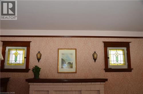 Stained glass windows over fireplace (electric) - 25 Fairmount Avenue, Hamilton, ON - Indoor Photo Showing Other Room
