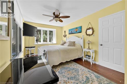 Bedroom featuring dark wood-style flooring and ceiling fan - 5590 Blind Line, Burlington, ON - Indoor Photo Showing Bedroom