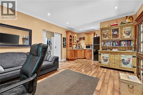 Office space featuring ornamental molding, light wood-style floors, and recessed lighting - 5590 Blind Line, Burlington, ON - Indoor