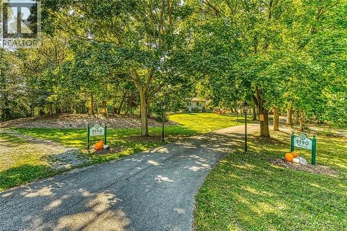 View of community featuring a lawn - 5590 Blind Line, Burlington, ON - Outdoor