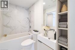 Bathroom featuring bathing tub / shower combination and vanity - 