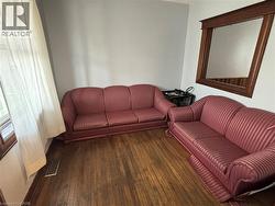 Living room featuring hardwood / wood-style flooring - 