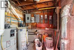 Utility room with water heater and electric panel - 