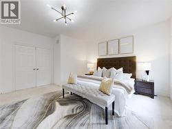 Bedroom featuring carpet, a closet, and a chandelier - 