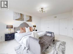 Carpeted bedroom featuring a closet and a chandelier - 