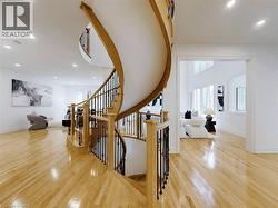 Stairway featuring recessed lighting and hardwood / wood-style floors - 