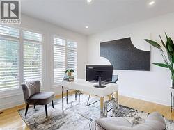 Office space with light wood finished floors and recessed lighting - 