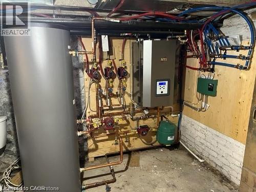 Utility room featuring gas water heater and water heater - 552 7Th Avenue, Hanover, ON - Indoor Photo Showing Basement