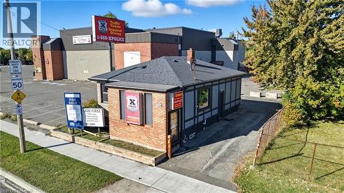 View of front of property with brick siding and a shingled roof - 1036 Upper Wentworth Street, Hamilton, ON 